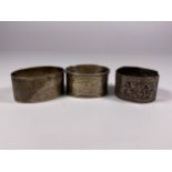 THREE HALLMARKED SILVER NAPKIN RINGS