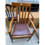 AN EARLY 20TH CENTURY OAK ELBOW CHAIR BEARING 'BROUGH BROS. LIVERPOOL' LABEL