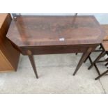 A 19TH CENTURY MAHOGANY AND CROSSBANDED FOLD-OVER CARD TABLE WITH CANTED FRONT ON TAPERING LEGS, 36"