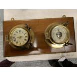 A BRASS SHIP STYLE CLOCKAND BAROMETER MOUNTED ON A MAHOGANY PLINTH