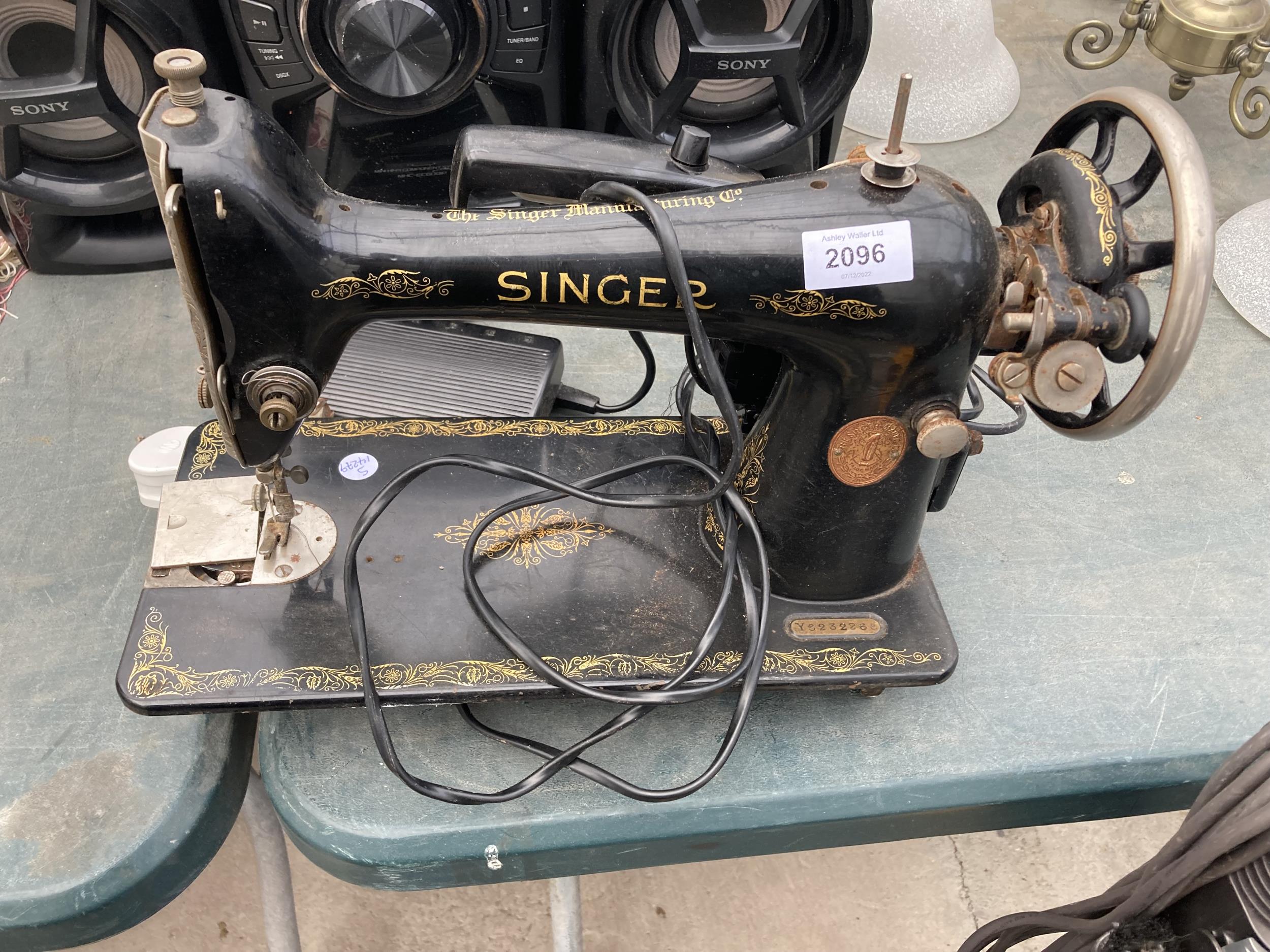 A VINTAGE SINGER SEWING MACHINE CONVERTED TO ELECTRIC