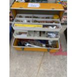 A PLASTIC TOOL BOX CONTAINING A NUMBER OF BRASS AND COPPER PIPE FITTINGS