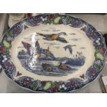 A LARGE OVAL VINTAGE PLATTER DECORATION OF DUCKS IN FLIGHT DIAMETER 46CM