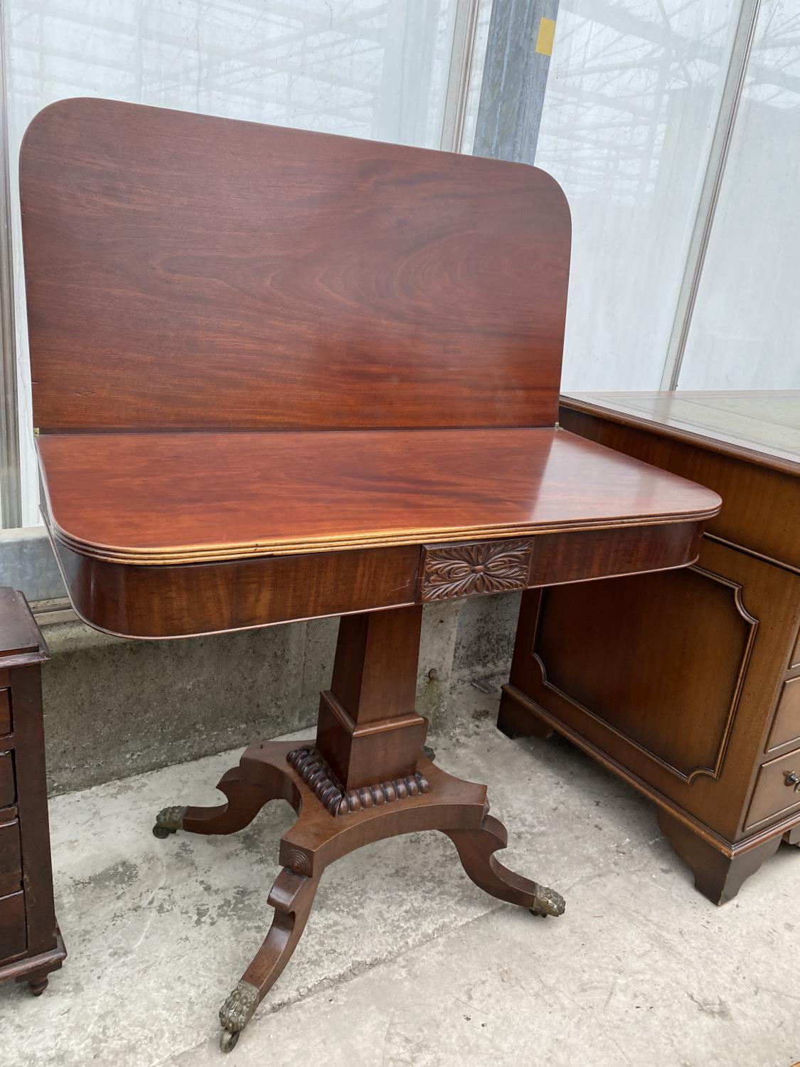 A 19TH CENTURY MAHOGANY FOLD-OVER CARD TABLE ON QUATREFOIL BASE WITH BRASS LION PAW FEET, 35" WIDE - Image 7 of 7