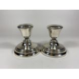 A PAIR OF BIRMINGHAM HALLMARKED SILVER DWARF CANDLESTICKS