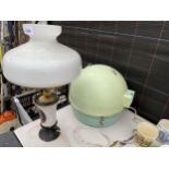 A TABLE LAMP WITH A GLASS SHADE AND A RETRO LADY SCHICK CONSOLETTI
