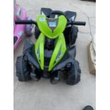 A CHILDRENS ELECTRIC RIDE ALONG QUAD BIKE WITH CHARGER BELIEVED IN WORKING ORDER BUT NO WARRANTY