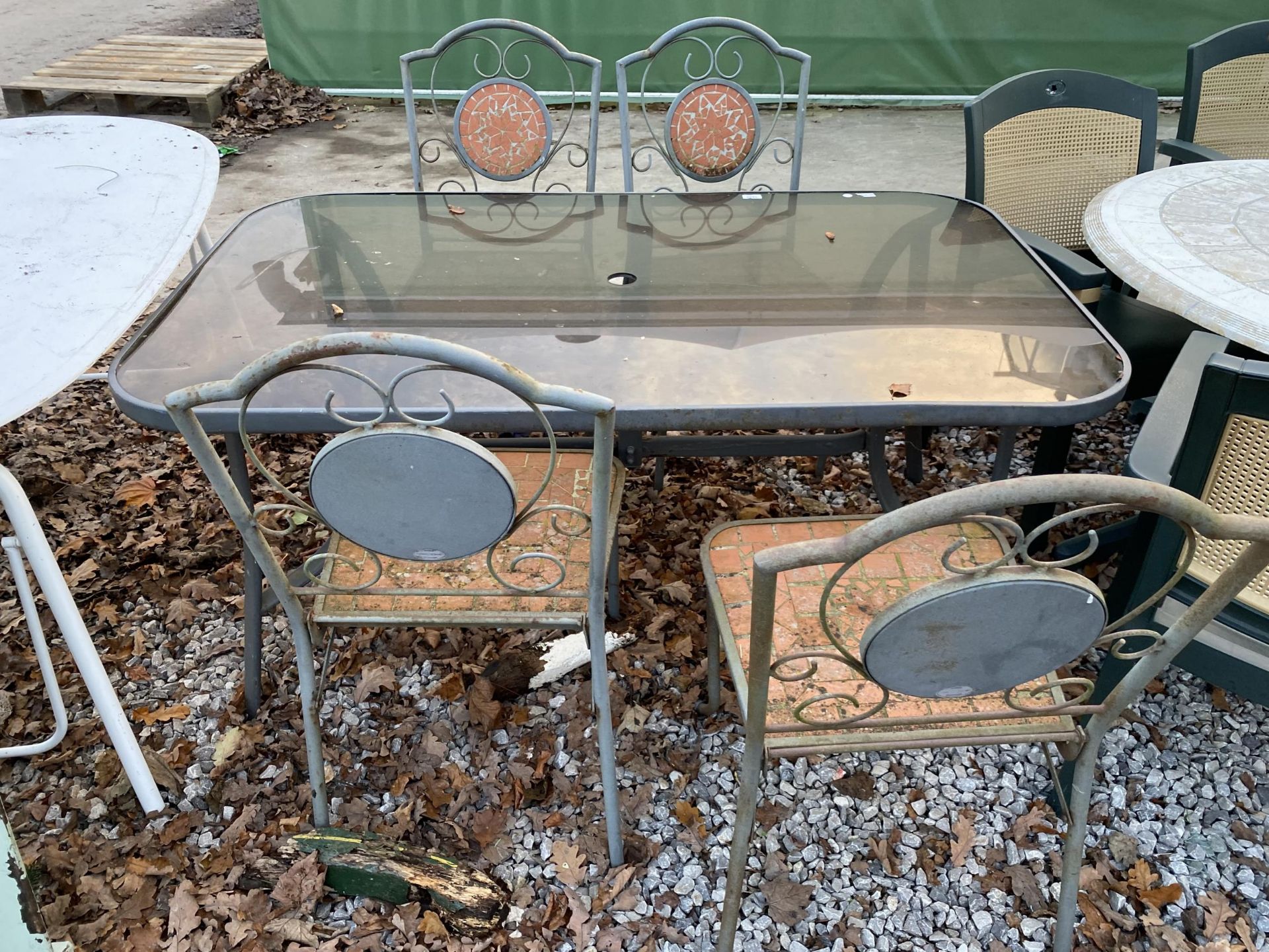 A GLASS TOPPED METAL GARDEN TABLE AND FOUR CHAIRS - Image 3 of 3