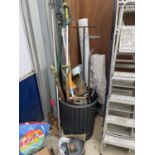 AN ASSORTMENT OF GARDEN TOOLS TO INCLUDE A SPADE, A FORK AND SAWS ETC