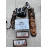 AN ASSORTMENT OF ITEMS TO INCLUDE TWO TREEN WALL MASKS, TWO FRAMES WITH CIGARETTE CARDS AND A CAMERA
