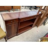 A REPRODUCTION MAHOGANY AND CROSSBANDED BREAKFRONT BOOKCASE WITH TWO CUPBOARDS AND THREE DRAWERS,