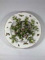 A POSSIBLY SITZENDORF 19TH CENTURY HARD PASTE PORCELAIN PLATE WITH FLORAL ENCRUSTED AND HAND PAINTED