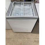 A WHITE GLASS TOPPED SHOP FREEZER