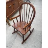 A MODERN CHILDS WINDSOR STYLE ROCKING CHAIR