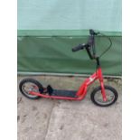 A ROAKCET FRAME CHILDRENS SCOOTER WITH LARGE WHEELS
