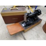 AN ELECTRIC SINGER SEWING MACHINE WITH FOOT PEDAL AND CARRY CASE