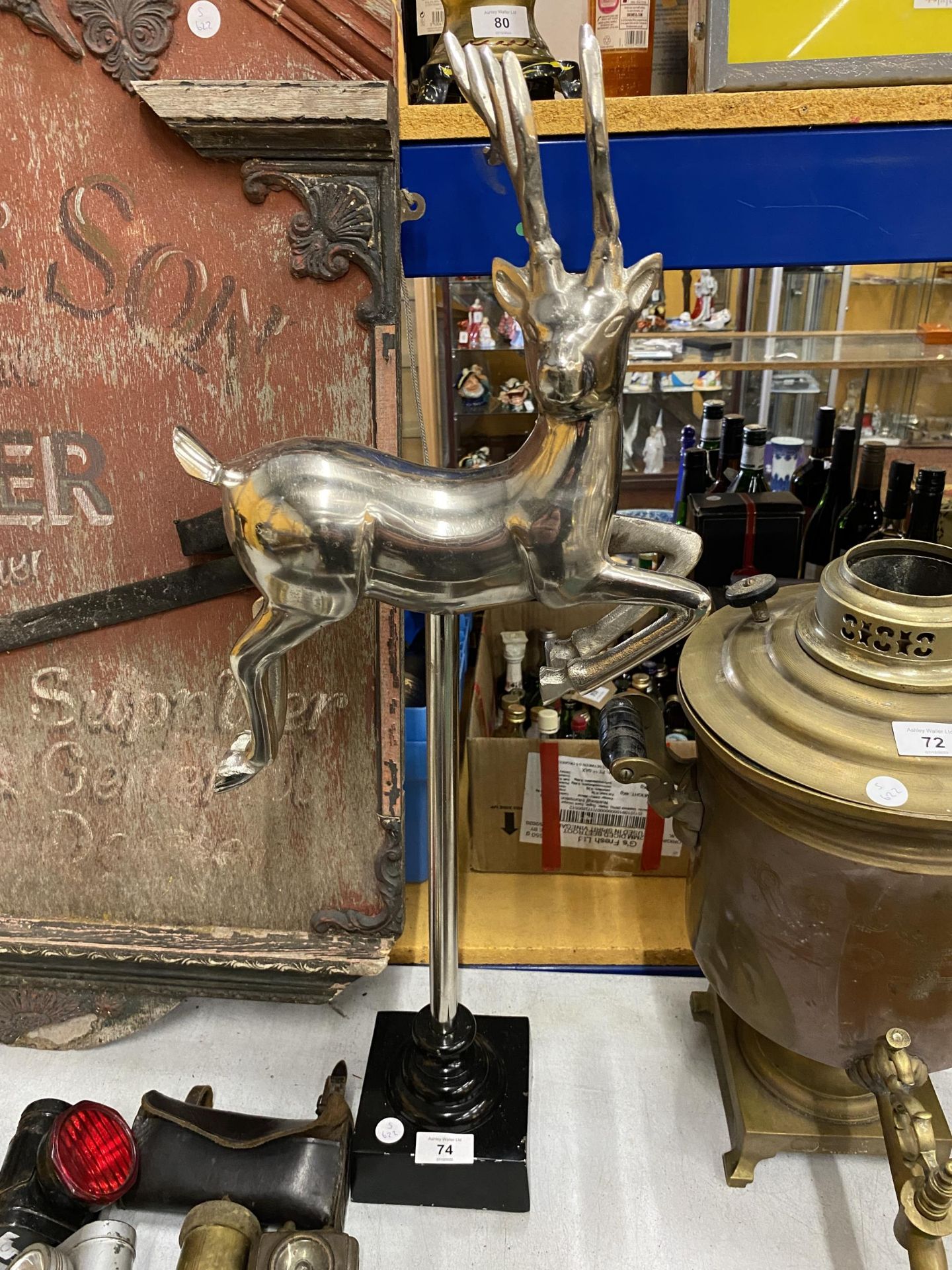 A LARGE CHROME EFFECT MODEL OF A DEER ON STAND, HEIGHT 71CM