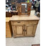 A VICTORIAN PINE SIDEBOARD ENCLOSING TWO DRAWERS AND TWO CUPBOARDS, 39" WIDE