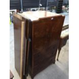 A MID 20TH CENTURY WALNUT TALLBOY AND BEDHEAD