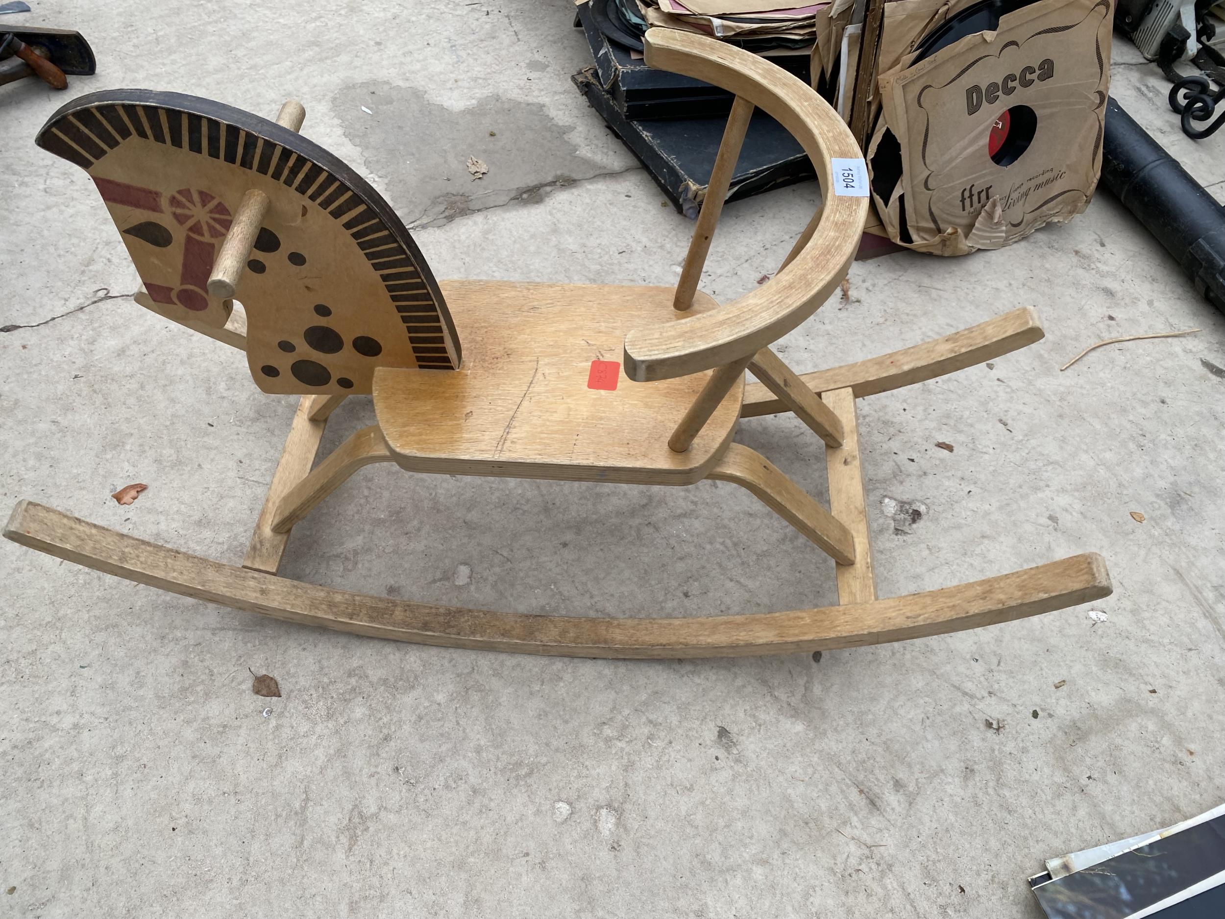A VINTAGE WOODEN CHILDS ROCKING HORSE SEAT