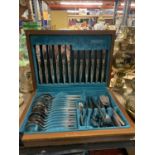 A VINTAGE CANTEEN OF CUTLERY IN A TEAK BOX