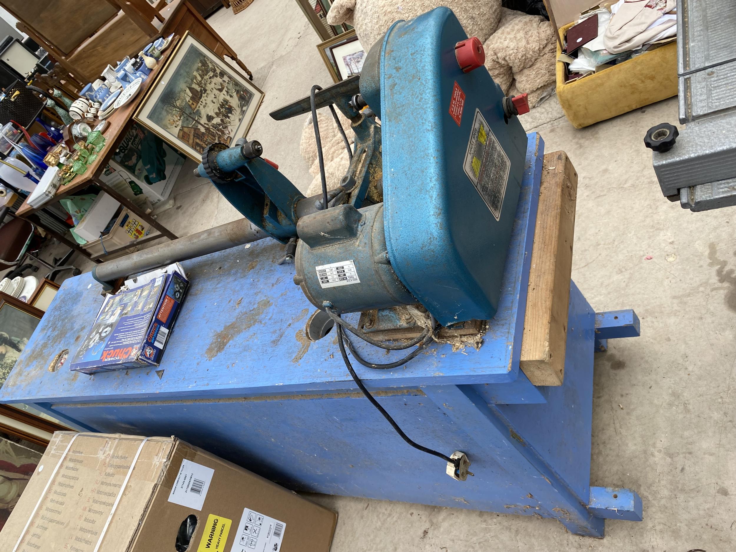 A NAEROK LTD. WOOD LATHE FIXED TO A WOODEN WORK BENCH ENCLOSING TWO LOWER CUPBOARDS AND FOUR - Image 2 of 8