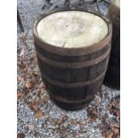 A VINTAGE OAK WHISKY BARREL WITH METAL BANDING (HEIGHT 90 CM)