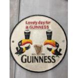 A CAST 'LOVELY DAY FOR A GUINNESS' SIGN DIAMETER 23CM