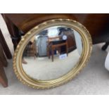 A ATSONIA GILT FRAMED CONVEX WALL MIRROR, 16" DIA