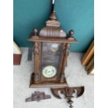 A DECORATIVE WOODEN CASED VIENNA STYLE WALL CLOCK
