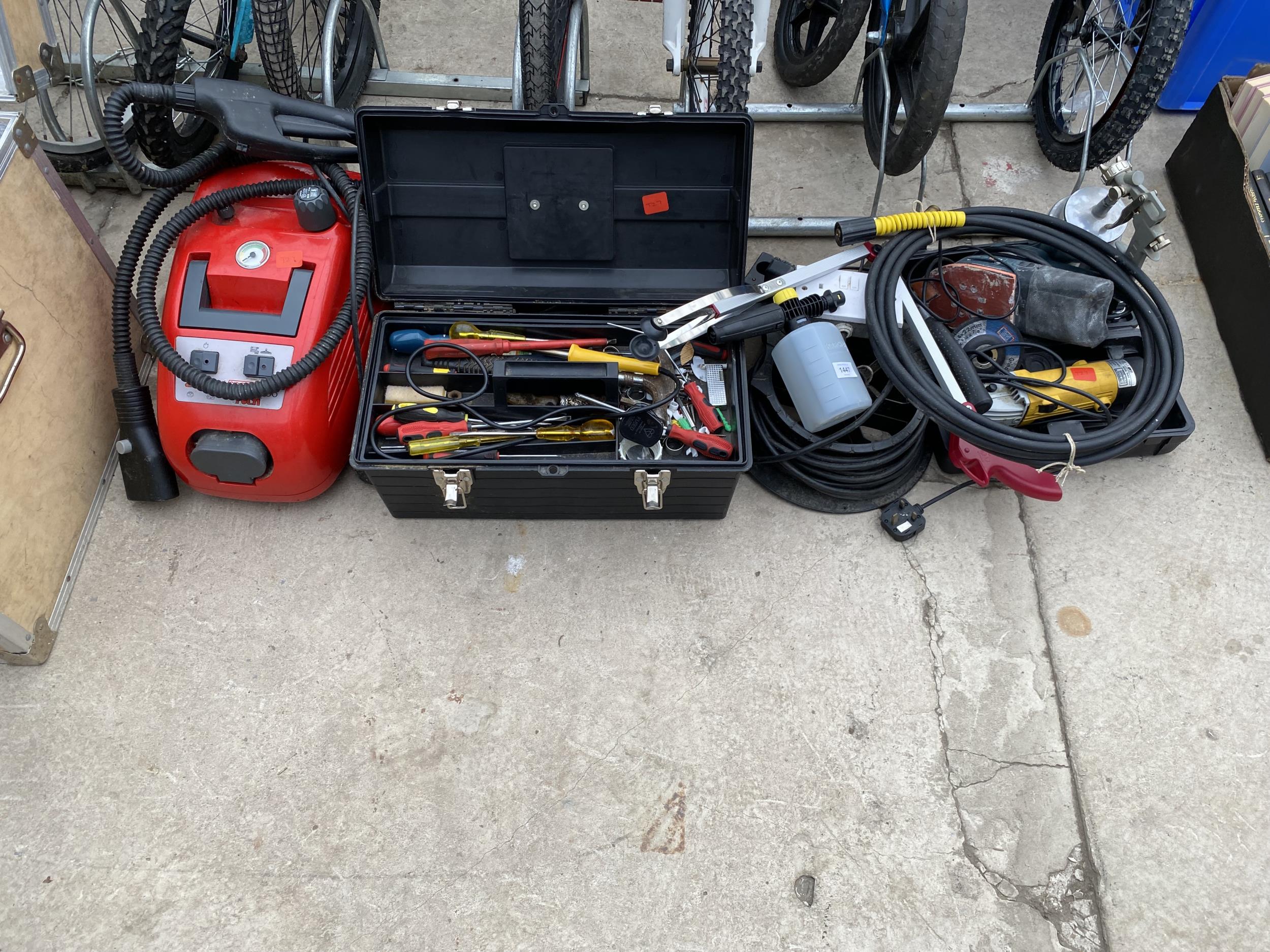 A LARGE ASSORTMENT OF TOOLS TO INCLUDE SCREW DRIVERS, PRESSURE WASHER PIUPE, A COMPRESSORE PAINT