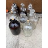 A COLLECTION OF ELEVEN GLASS DEMI JOHNS (SOME WITH CORK STOPPERS)