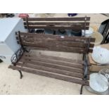 A PAIR OF WOODEN SLATTED GARDEN BENCHES WITH CAST BENCH ENDS