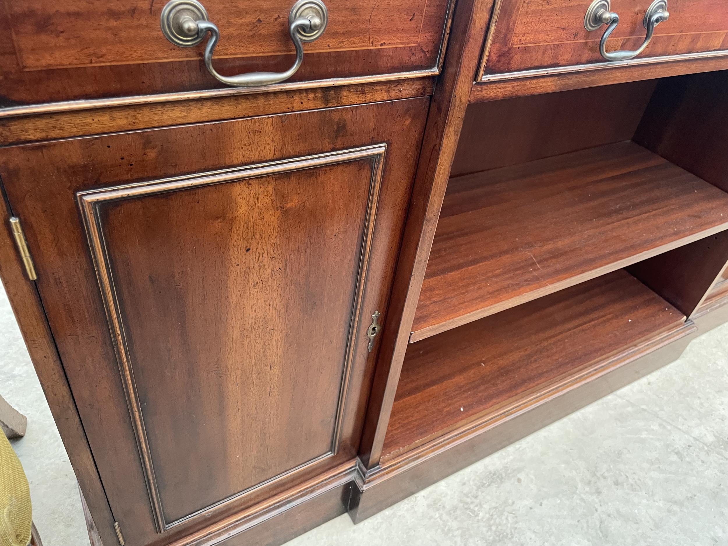 A REPRODUCTION MAHOGANY AND CROSSBANDED BREAKFRONT BOOKCASE WITH TWO CUPBOARDS AND THREE DRAWERS, - Image 3 of 4