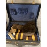 A VINTAGE SUITCASE CONTAINING VINTAGE BRUSHES WITH MONOGRAMS, CAPS, SCARVES, ETC