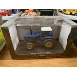 A UNIVERAL HOBBIES MODEL TRACTOR FORD TW 304X4 1:32 SCALE ITEM NO 4023