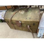 A VINTAGE DOME TOPPED TRAVEL TRUNK WITH LEATHER STRAPS AND CARRYING HANDLES