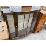 A SHINY WALNUT DISPLAY CABINET