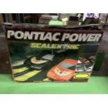 A BOXED VINTAGE PONTIAC POWER SCALEXTRIC SET (ONE CAR IS A PONTIAC THE OTHER A FORMULA 1)