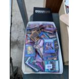 A LARGE ASSORTMENT OF YU-GI-UH TRADING CARDS