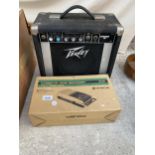 A PEAVEY AMPLIFIER AND A CASSETTE TAPE RECORDER