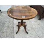 AN OVAL MAHOGANY AND BRASS INLAID WINE TABLE