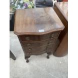 A MINIATURE MAHOGANY CHEST OF FOUR DRAWERS ON CABRIOLE SUPPORTS