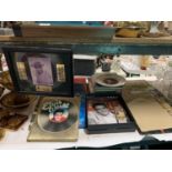 A LARGE QUANTITY OF ELVIS MEMORABILIA TO INCLUDE VINYL LP RECORDS, BOOKS, MAGAZINES, ETC