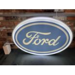 A FORD DOUBLE SIDED ILLUMINATED LIGHT BOX SIGN WITH BRACKET - WORKING ORDER AT TIME OF
