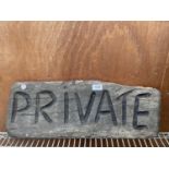 A WOODEN CARVED 'PRIVATE' SIGN