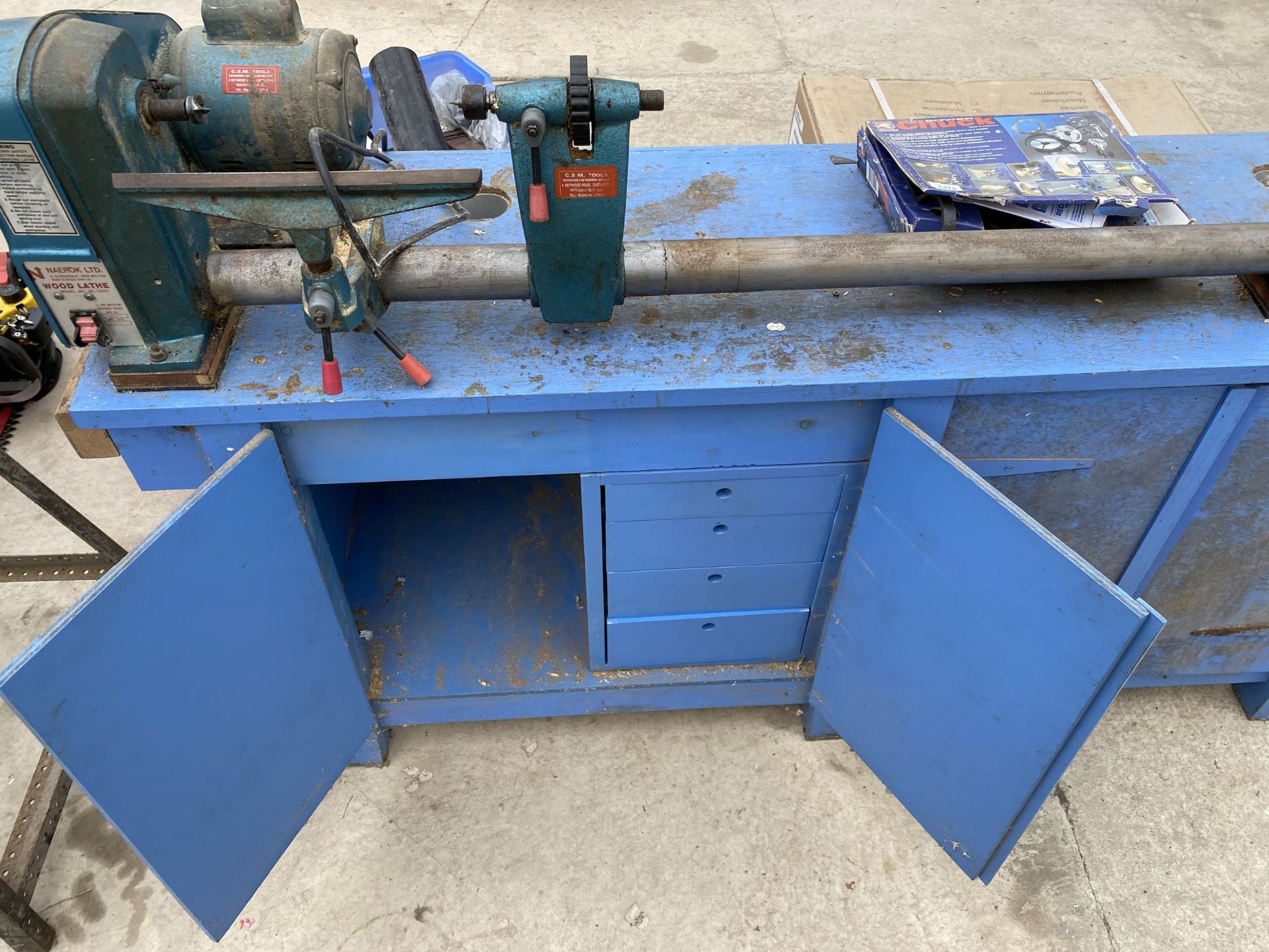 A NAEROK LTD. WOOD LATHE FIXED TO A WOODEN WORK BENCH ENCLOSING TWO LOWER CUPBOARDS AND FOUR - Image 7 of 8