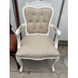A WHITE 'DUNELM' CONTINENTAL STYLE OPEN ARMCHAIR