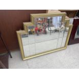 A GILT FRAMED WALL MIRROR, 38" X 30"