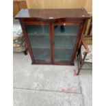 AN EDWARDIAN BOWFRONTED TWO DOOR GLAZED BOOKCASE, 34" WIDE